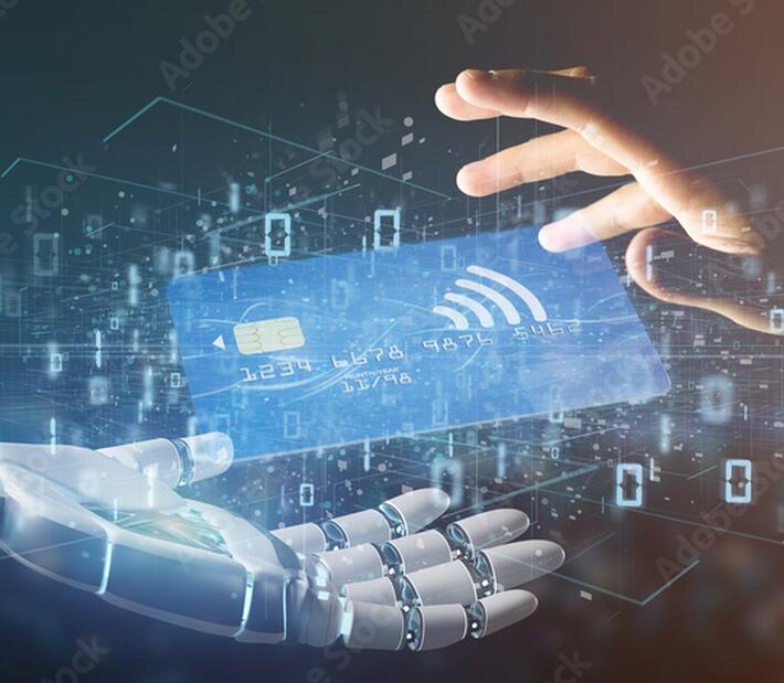 Eine menschliche Hand und eine Roboterhand sind von Zahlen umgeben und greifen nach einer Kreditkarte